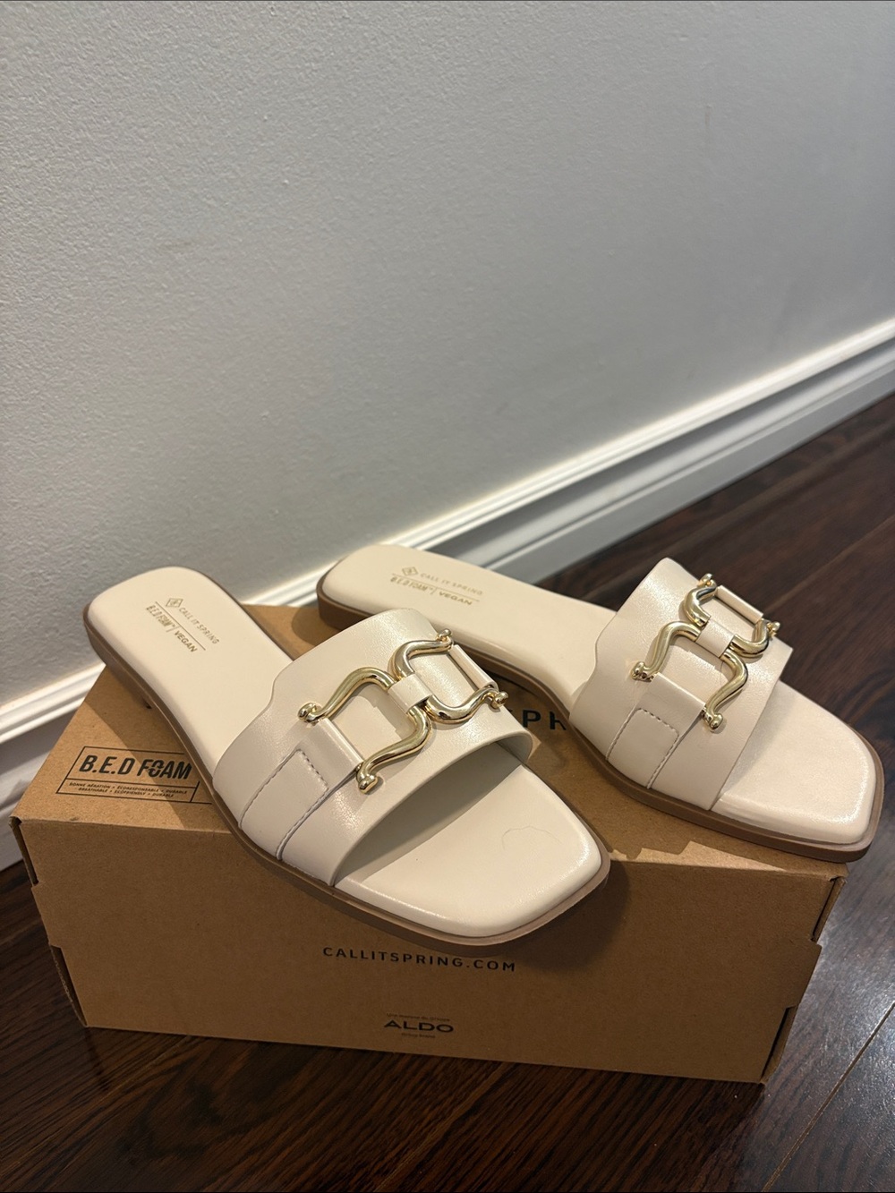 Call It Spring Cream Slide Sandals with Gold Chain Detail